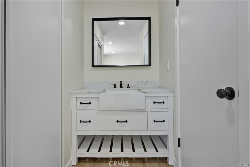 40635 159th Street East Lancaster, CA 93535 - Photo 17 of 25 a bathroom with a sink and a mirror