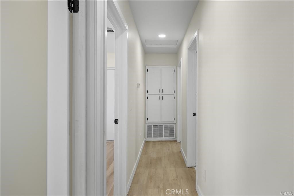 40635 159th Street East Lancaster, CA 93535 - Photo 22 of 25 a view of a hallway with wooden floor