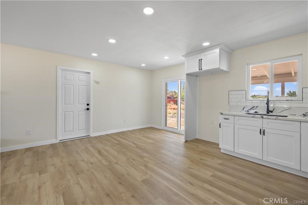 40635 159th Street East Lancaster, CA 93535 - Photo 7 of 25 a view of kitchen with granite countertop cabinets and sink