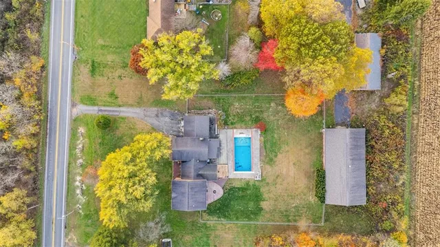 a bird view of a house with a yard