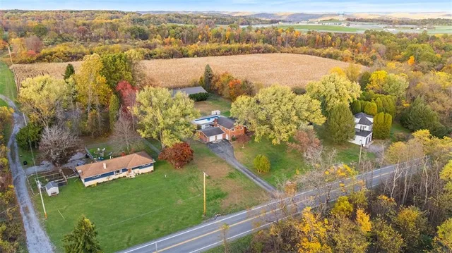 an aerial view of residential houses with outdoor space