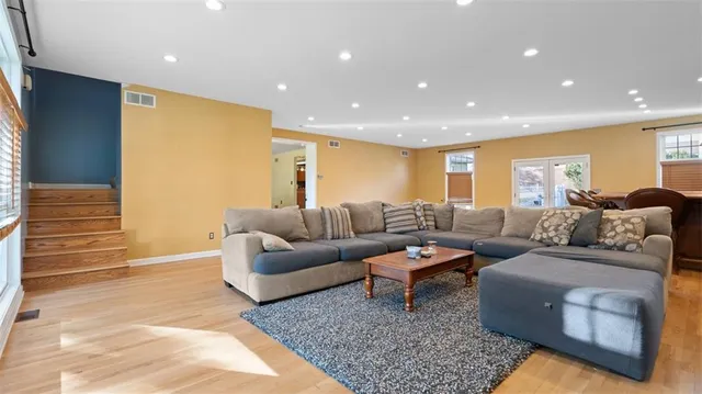 a living room with furniture and a rug