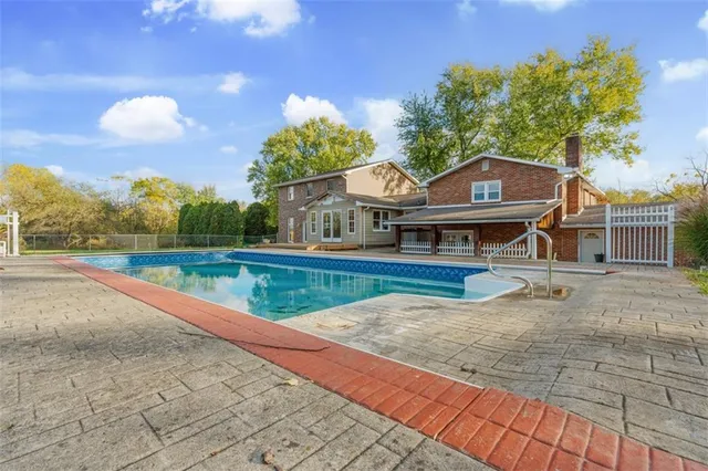 swimming pool view with a outdoor space