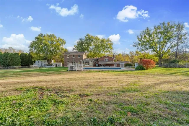 a view of a house with a big yard