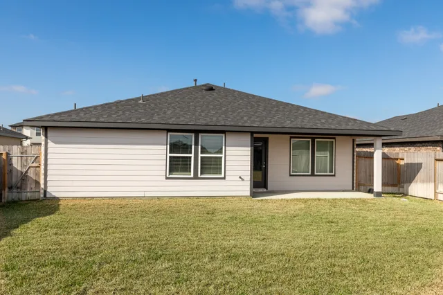 a house with yard in front of it