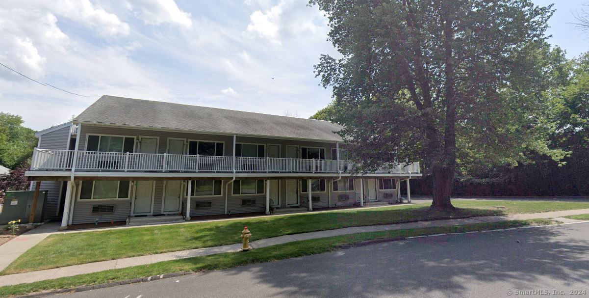 17 Kohanza Street, Unit 8 Danbury, CT 06811 - Photo 1 of 7 a front view of a house with a yard