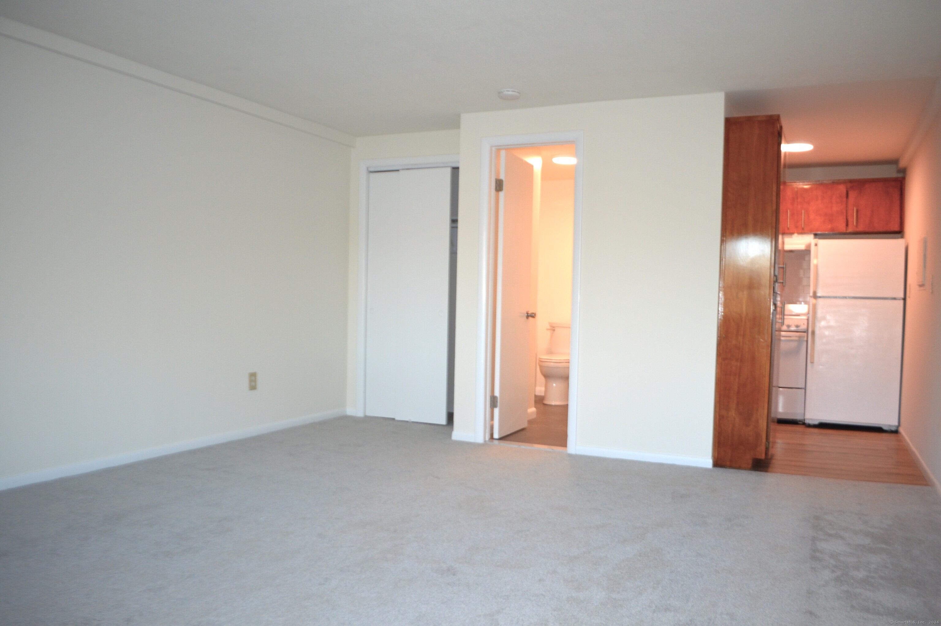 17 Kohanza Street, Unit 8 Danbury, CT 06811 - Photo 3 of 7 a view of an empty room