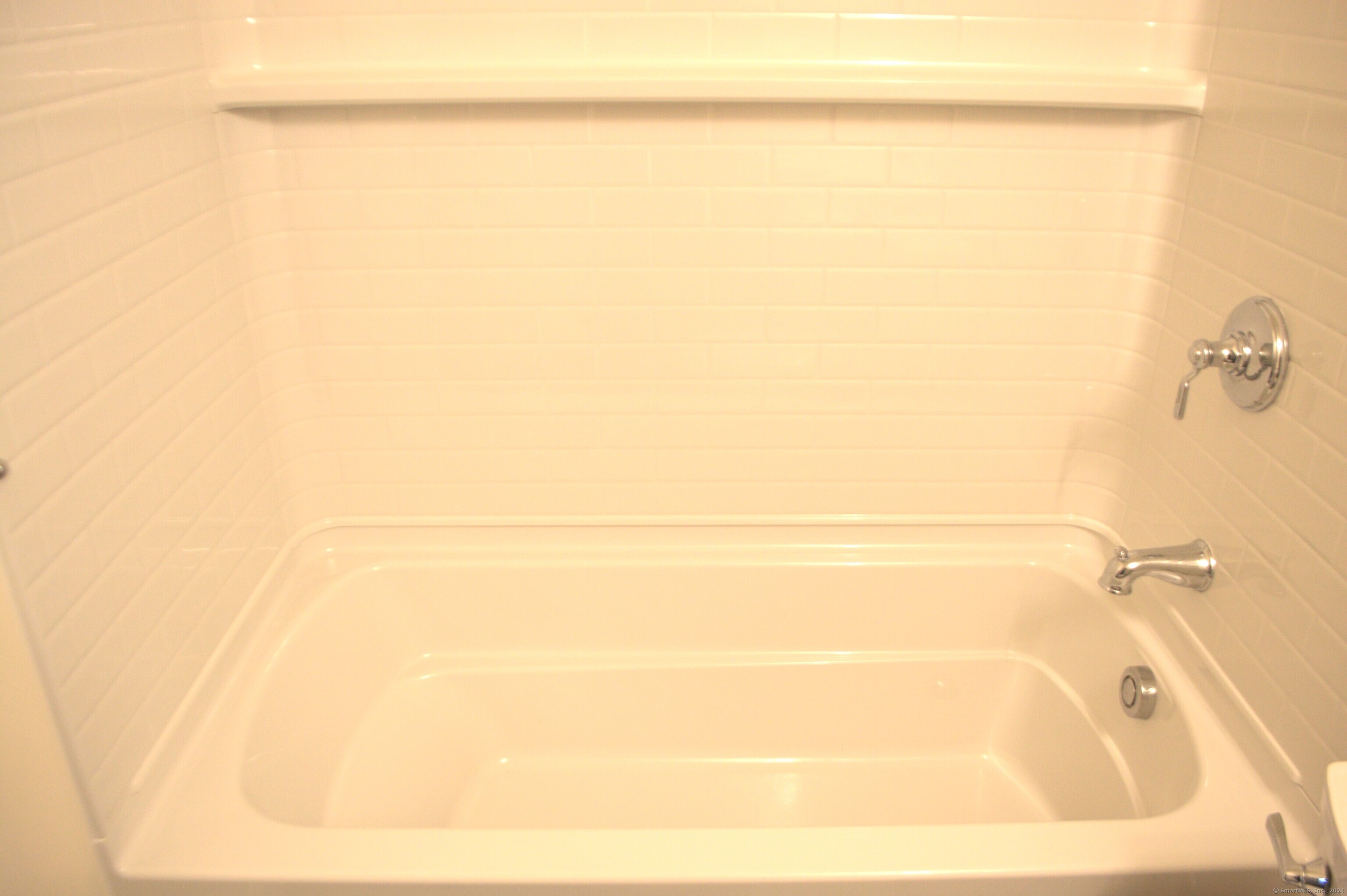 17 Kohanza Street, Unit 8 Danbury, CT 06811 - Photo 5 of 7 a bathroom with a shower