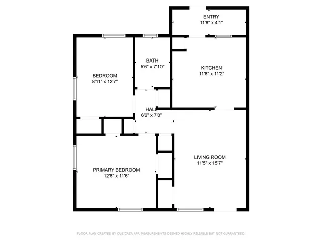 a picture of a bench in front of a wall