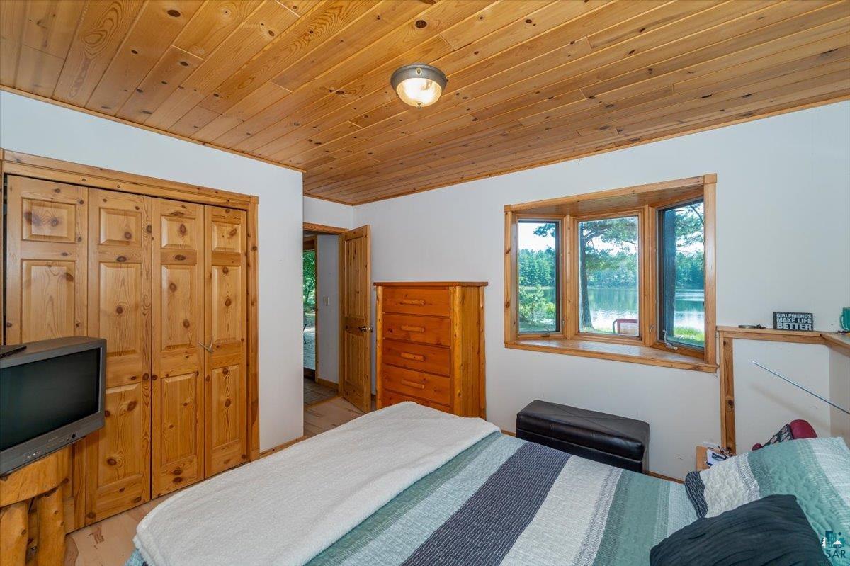 11758 South Long Lake Road Solon Springs, WI 54873 - Photo 22 of 38 Bedroom featuring wood ceiling and light hardwood / wood-style floors
