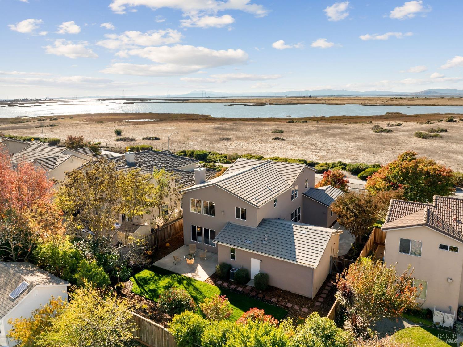 an aerial view of a house with a ocean view