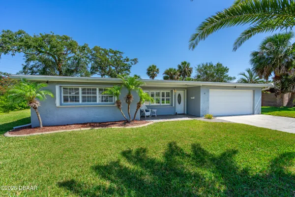front view of a house with a yard