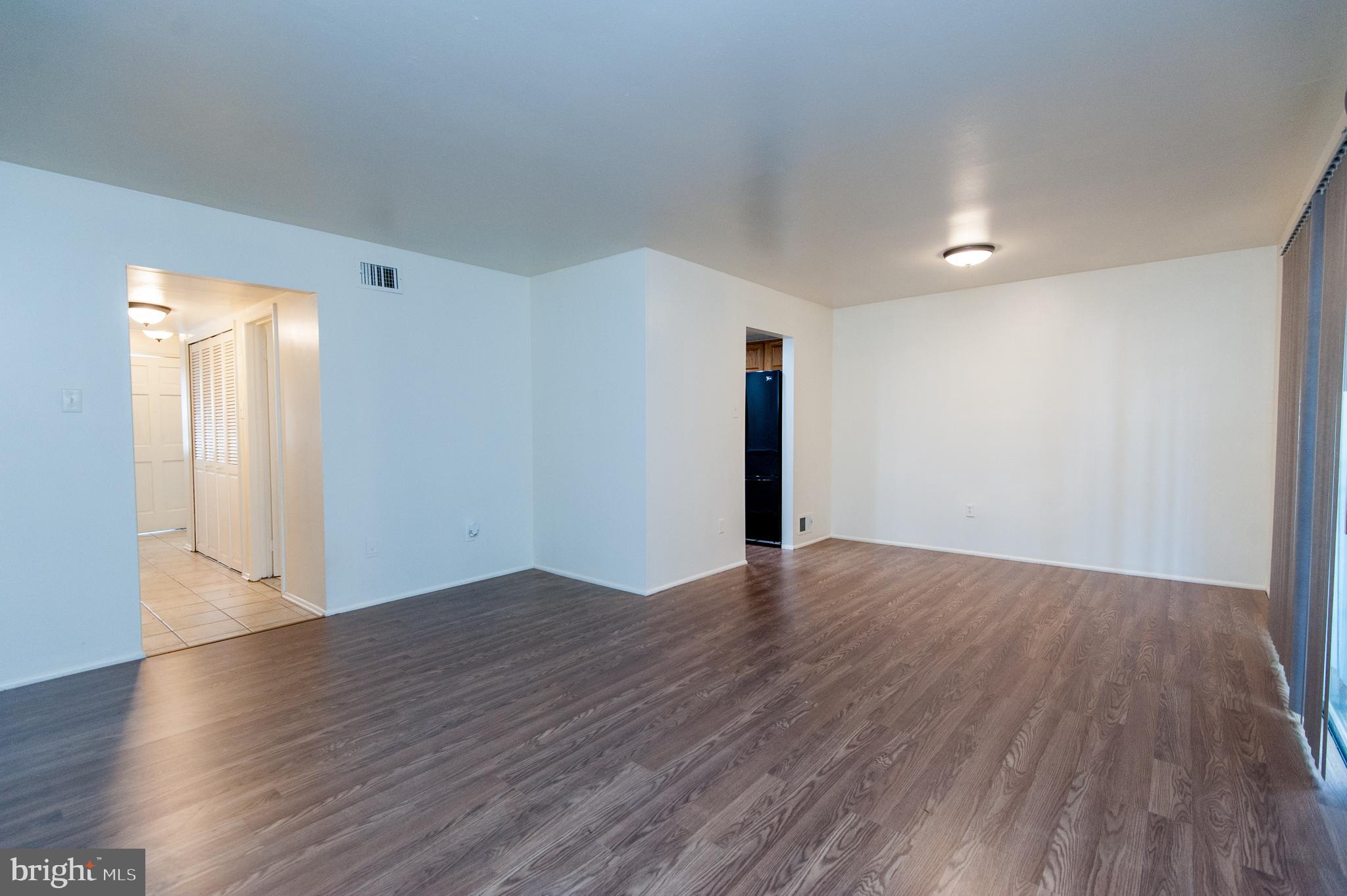 12013 Pheasant Run Drive Laurel, MD 20708 - Photo 13 of 34 a view of an empty room with wooden floor and closet