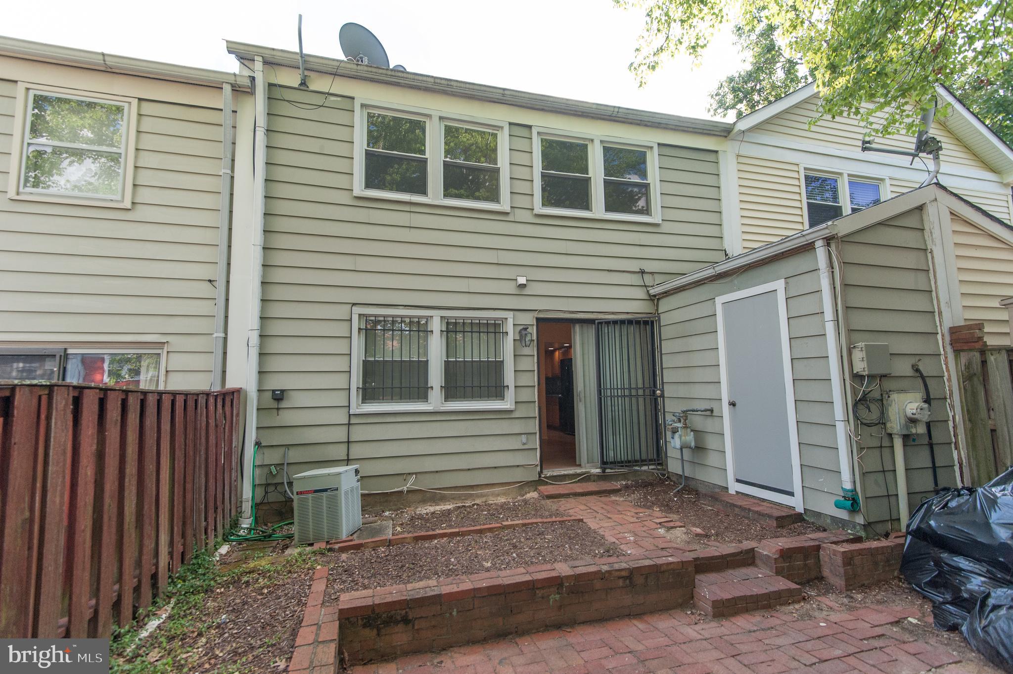 12013 Pheasant Run Drive Laurel, MD 20708 - Photo 14 of 34 a front view of a house with a yard