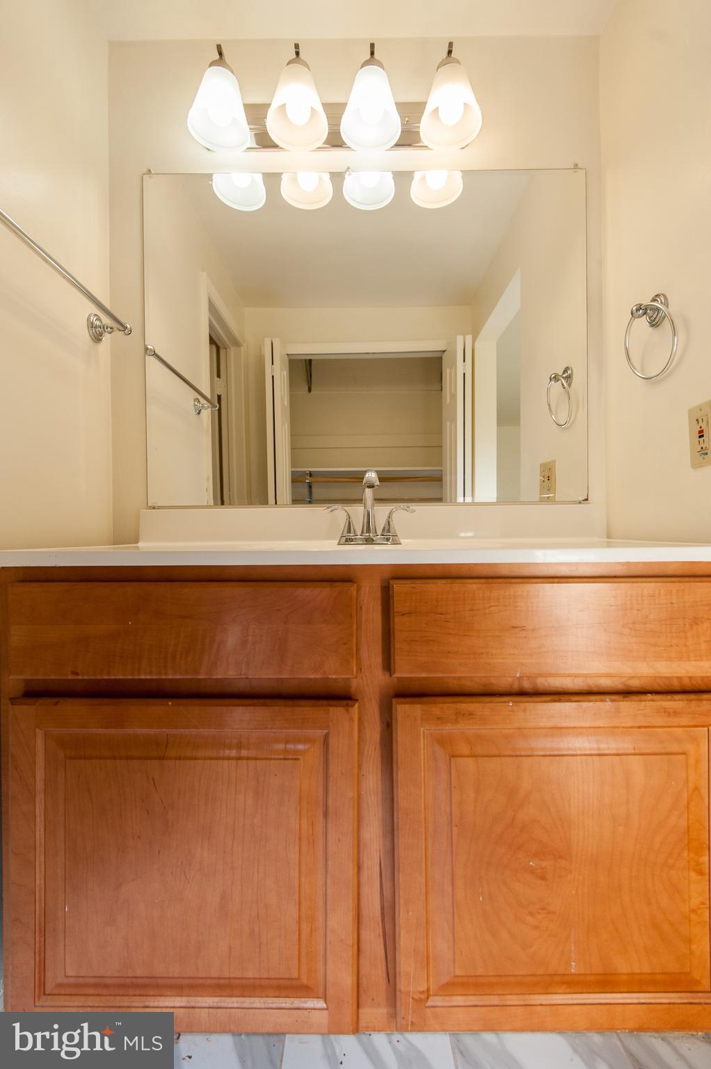 12013 Pheasant Run Drive Laurel, MD 20708 - Photo 20 of 34 a bathroom with a sink and a mirror
