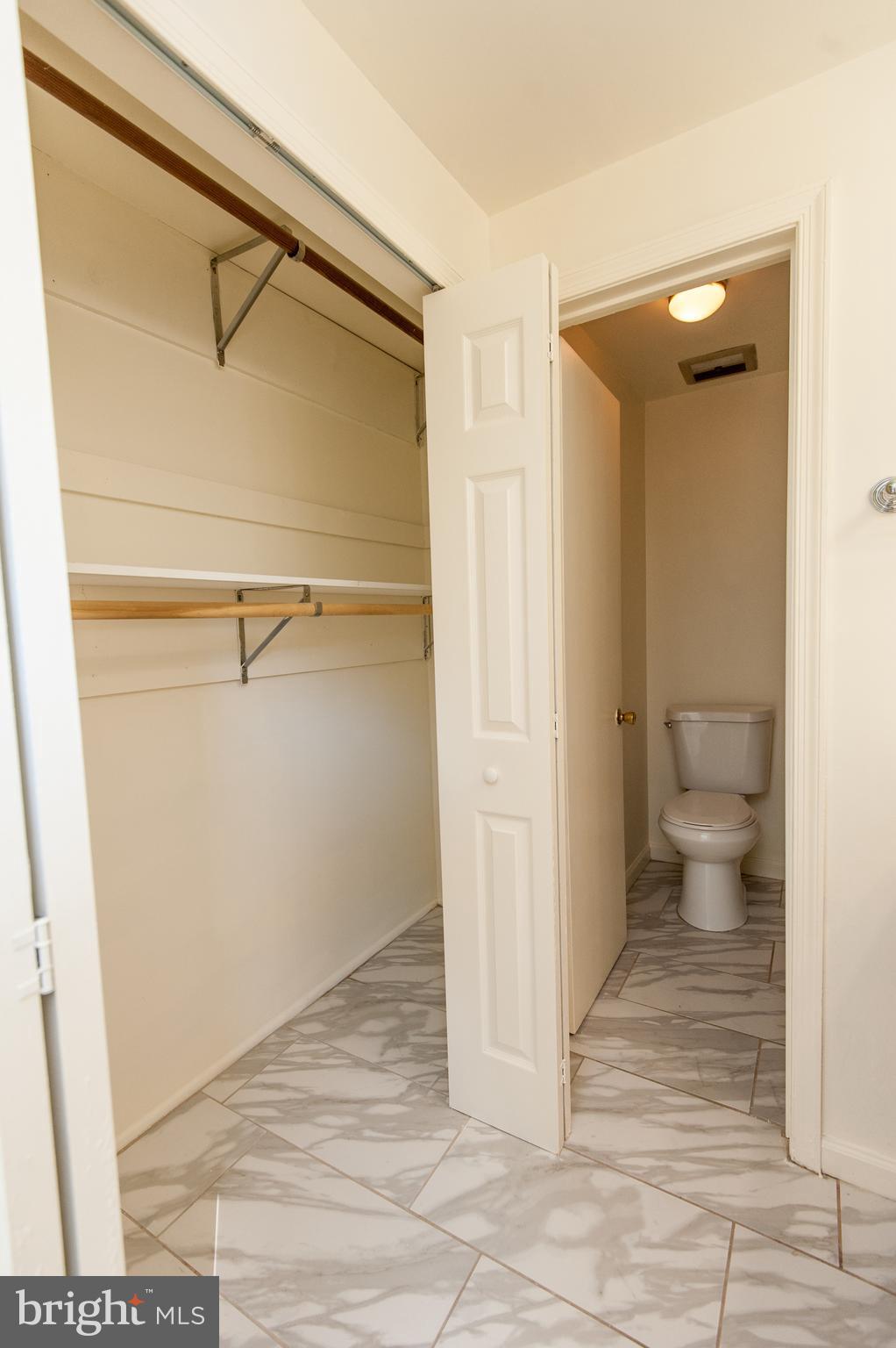 12013 Pheasant Run Drive Laurel, MD 20708 - Photo 21 of 34 a view of a room with wooden floor and a bathroom view