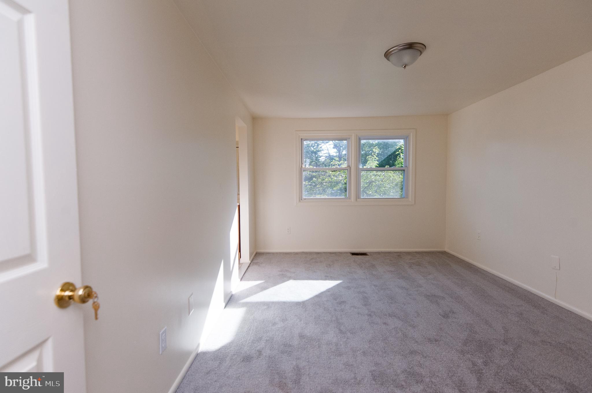 12013 Pheasant Run Drive Laurel, MD 20708 - Photo 29 of 34 an empty room with windows
