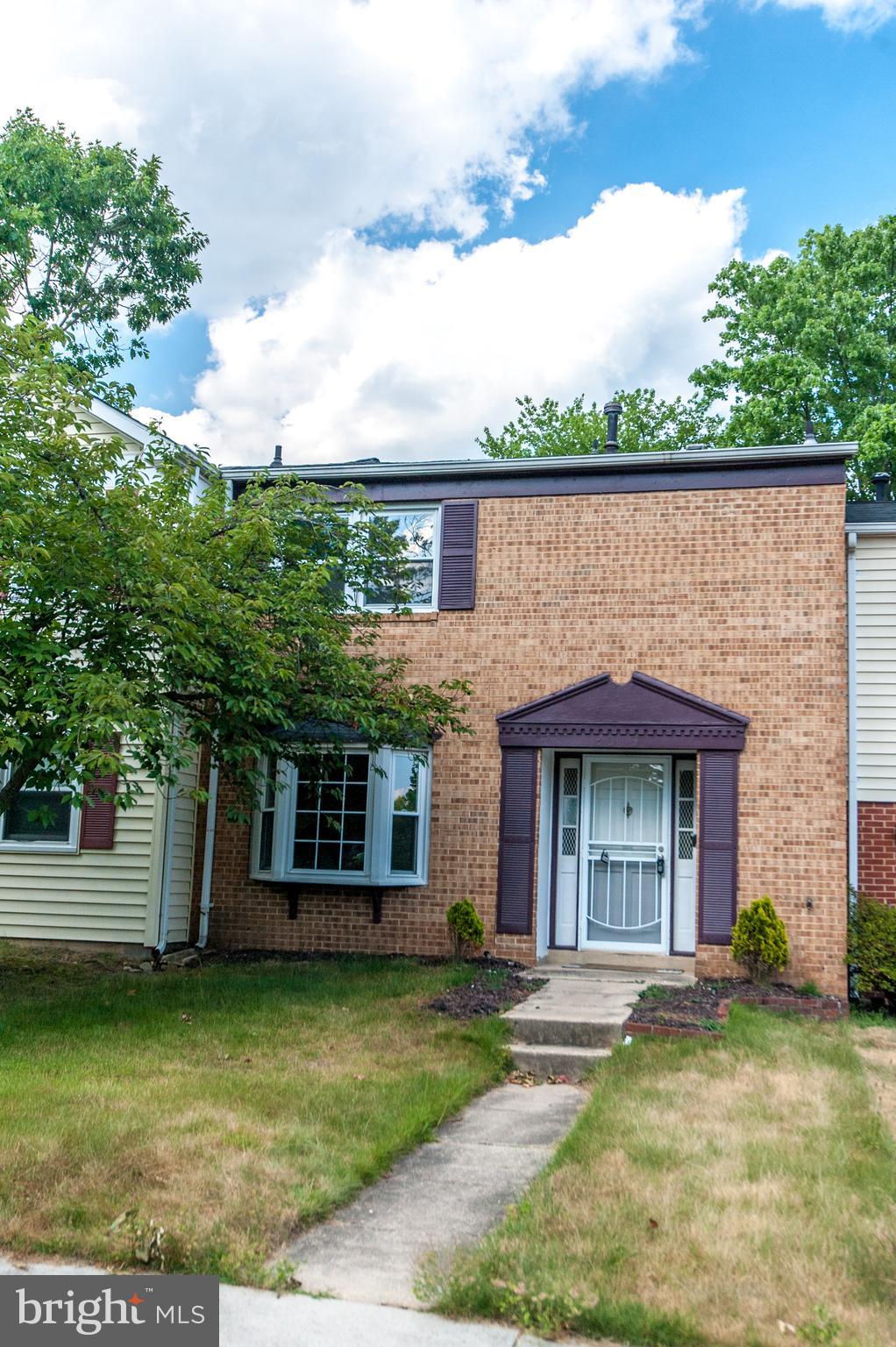 12013 Pheasant Run Drive Laurel, MD 20708 - Photo 3 of 34 a front view of a house with a garden