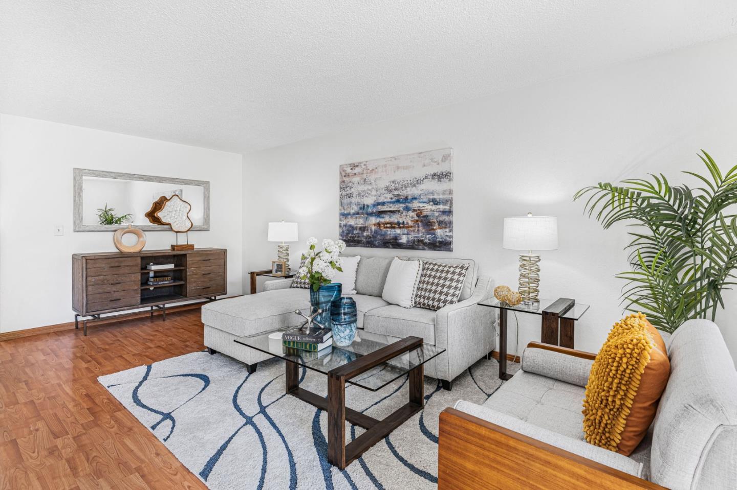 131 Wenatchee Common, Unit 14 Fremont, CA 94539 - Photo 1 of 30 a living room with furniture and wooden floor