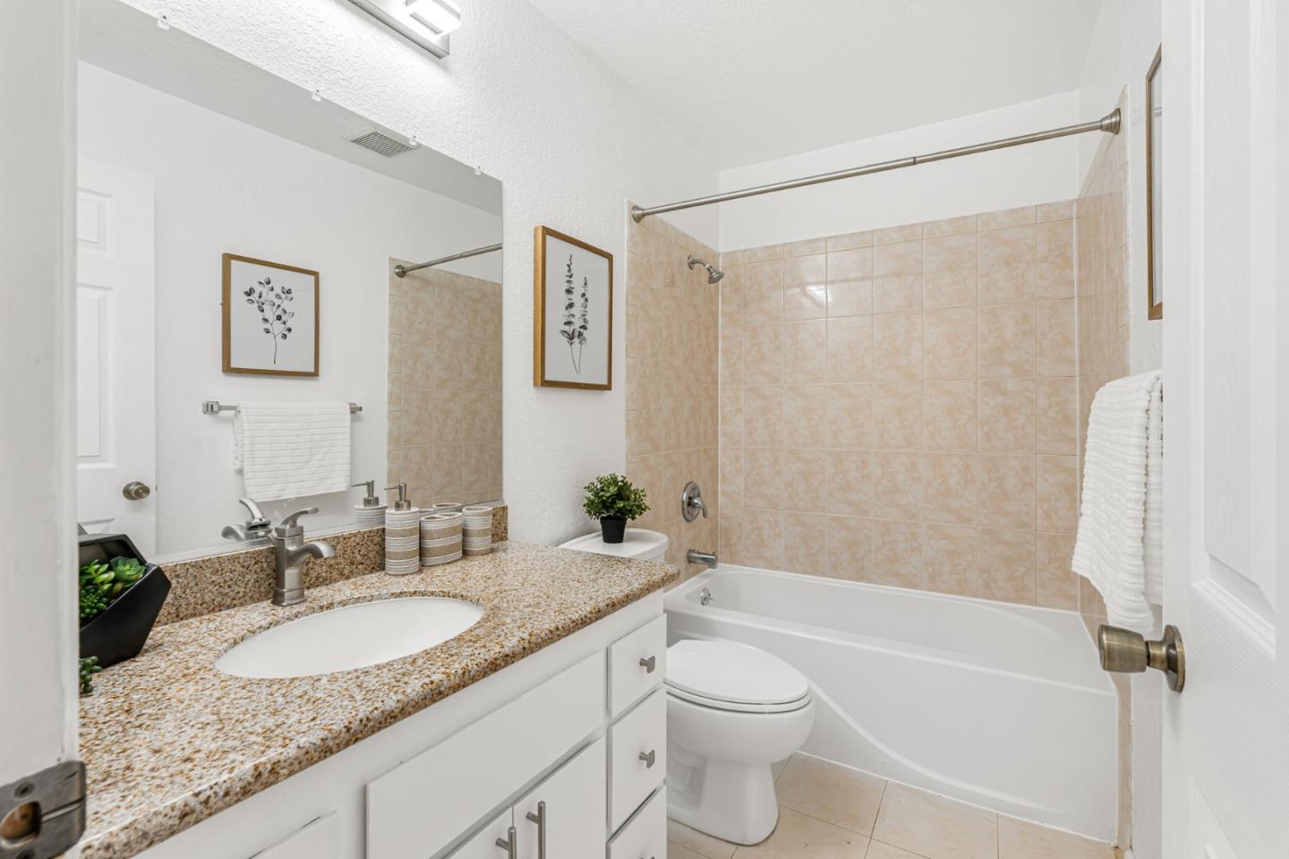 131 Wenatchee Common, Unit 14 Fremont, CA 94539 - Photo 11 of 30 a bathroom with a granite countertop sink toilet and shower