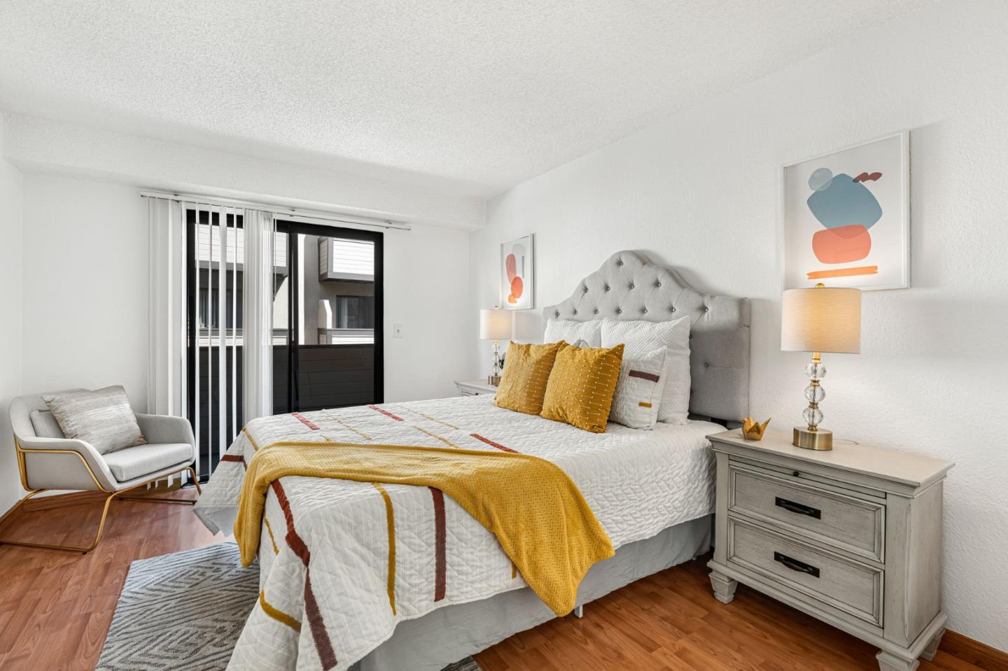 131 Wenatchee Common, Unit 14 Fremont, CA 94539 - Photo 14 of 30 a bedroom with a bed and wooden floor