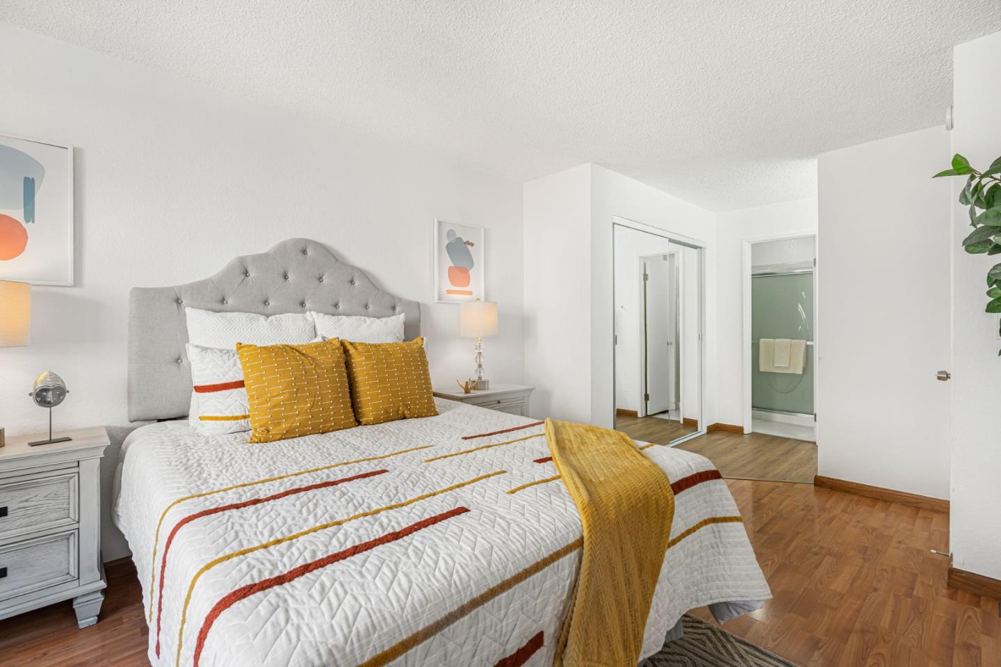 131 Wenatchee Common, Unit 14 Fremont, CA 94539 - Photo 15 of 30 a bedroom with a bed and a chandelier
