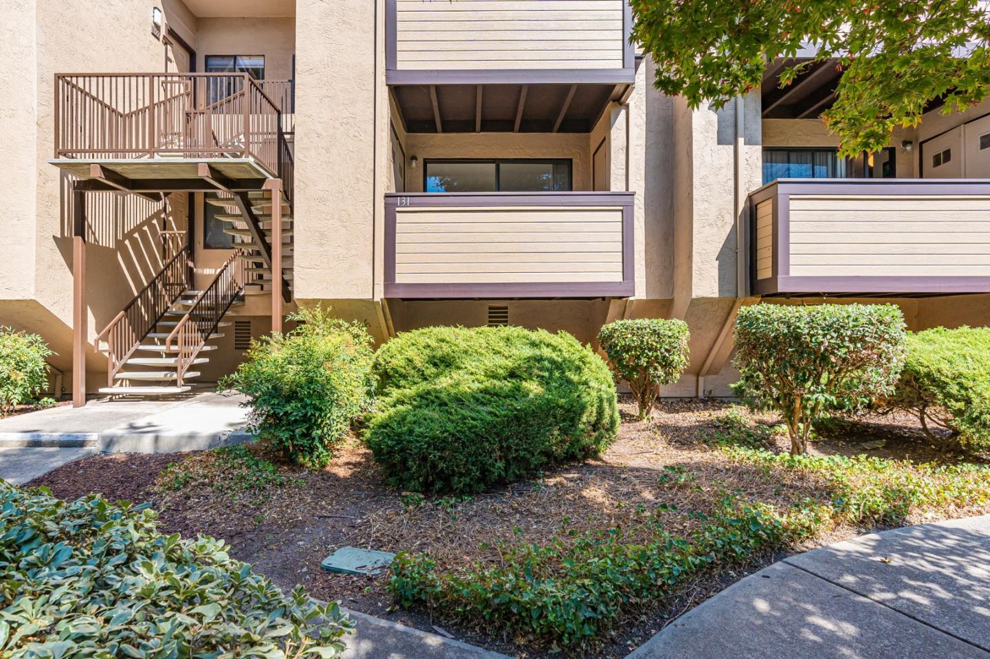 131 Wenatchee Common, Unit 14 Fremont, CA 94539 - Photo 19 of 30 a view of a house with a small garden