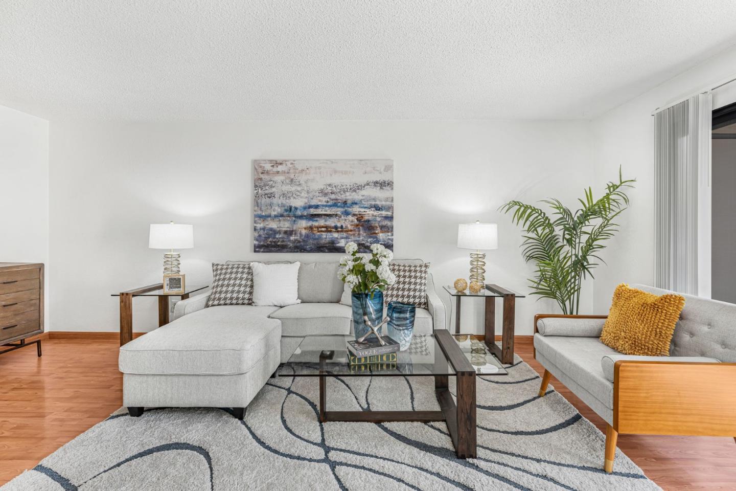 131 Wenatchee Common, Unit 14 Fremont, CA 94539 - Photo 2 of 30 a living room with furniture and wooden floor