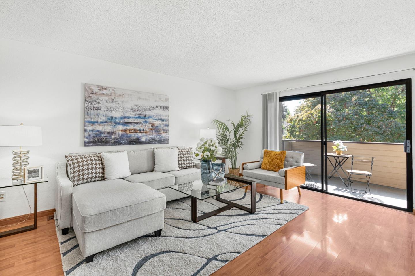 131 Wenatchee Common, Unit 14 Fremont, CA 94539 - Photo 3 of 30 a living room with furniture and a large window