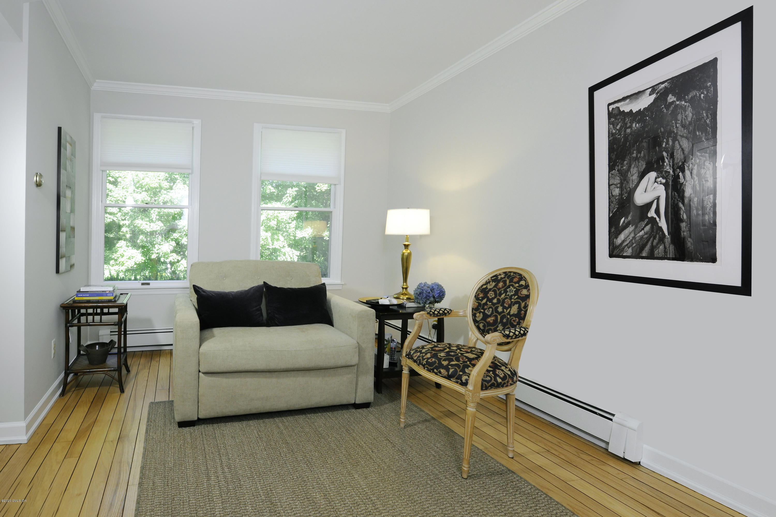 677 River Road Cos Cob, CT 06870 - Photo 12 of 23 a living room with furniture and a large window