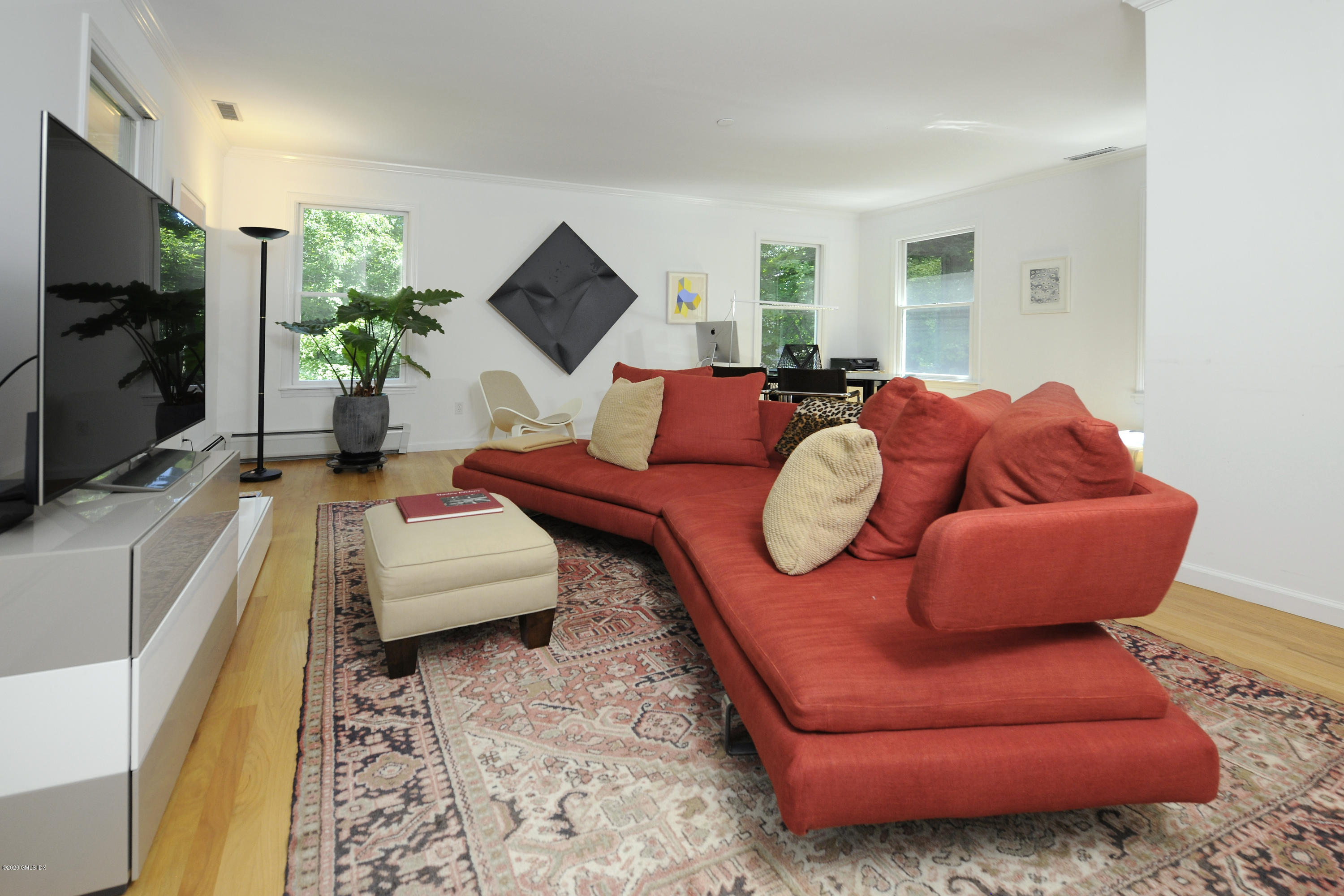 677 River Road Cos Cob, CT 06870 - Photo 15 of 23 a living room with furniture and a flat screen tv