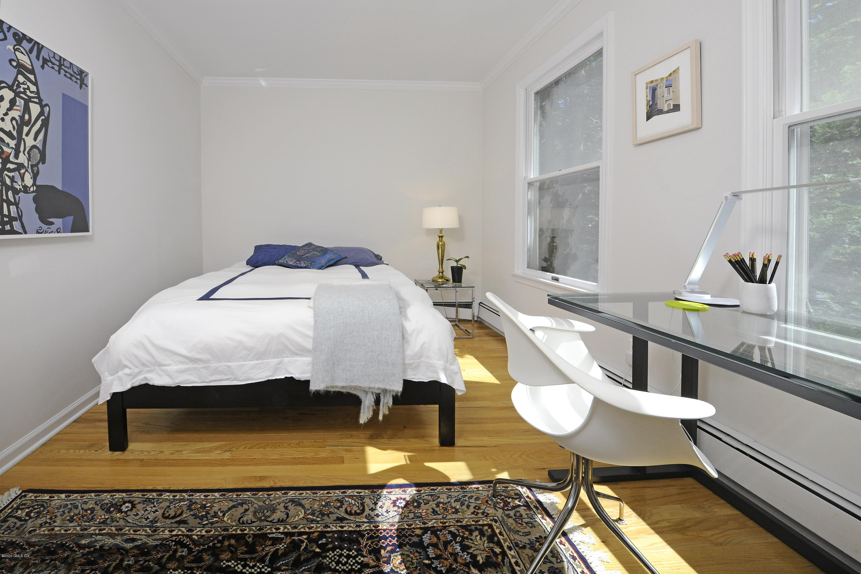 677 River Road Cos Cob, CT 06870 - Photo 17 of 23 a bed room with a bed and a table