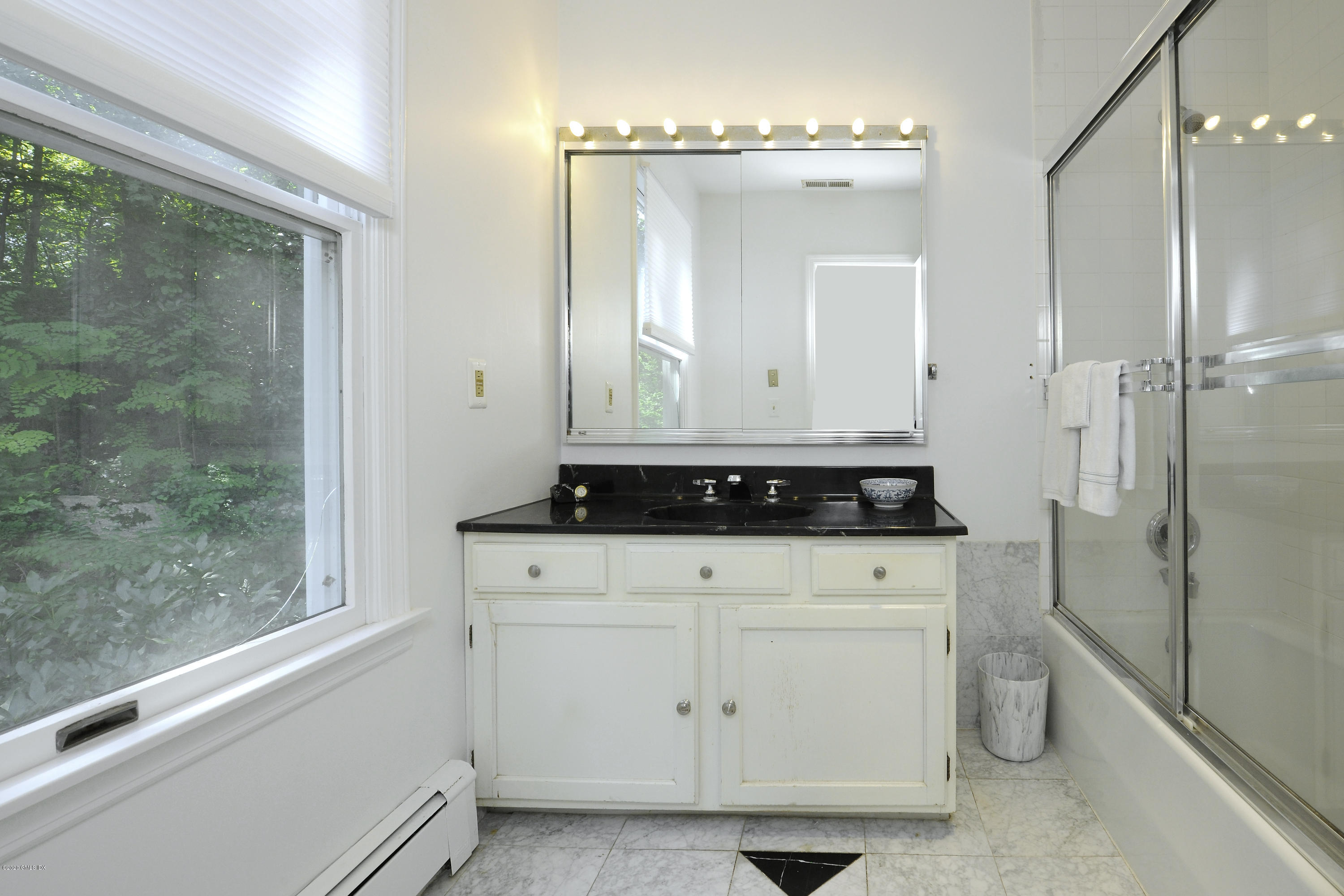 677 River Road Cos Cob, CT 06870 - Photo 18 of 23 a bathroom with a sink and a mirror