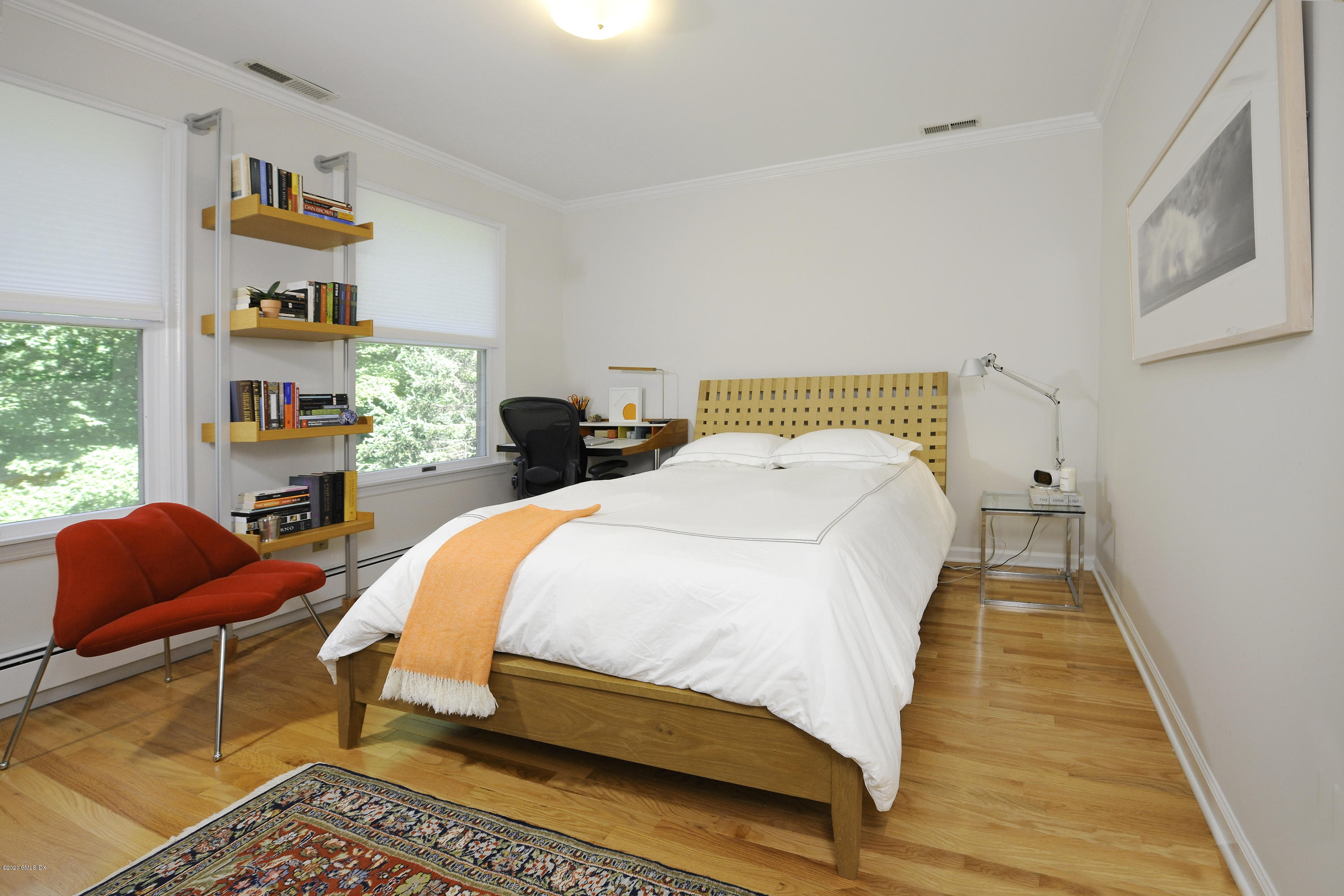 677 River Road Cos Cob, CT 06870 - Photo 19 of 23 a bed sitting in a bedroom next to a window