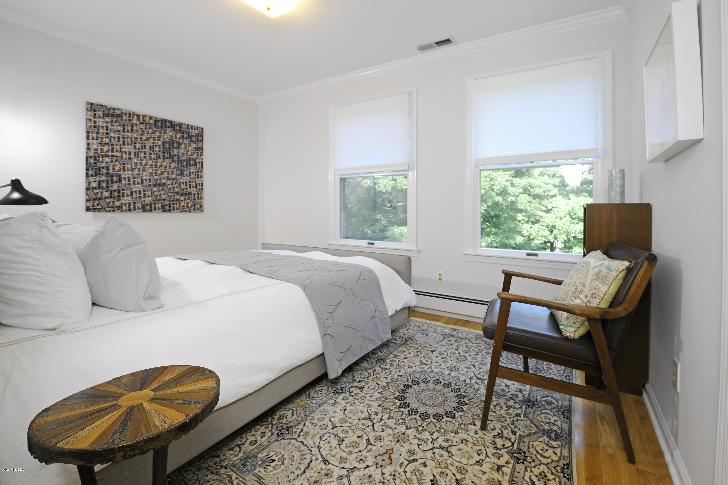 677 River Road Cos Cob, CT 06870 - Photo 20 of 23 a bedroom with a bed and a window