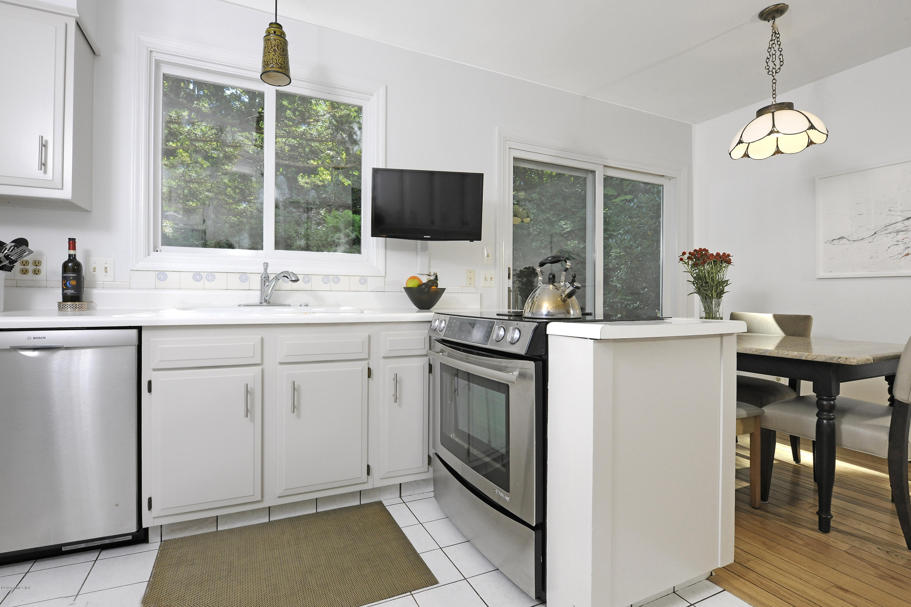 677 River Road Cos Cob, CT 06870 - Photo 10 of 23 a kitchen with a sink stove and microwave