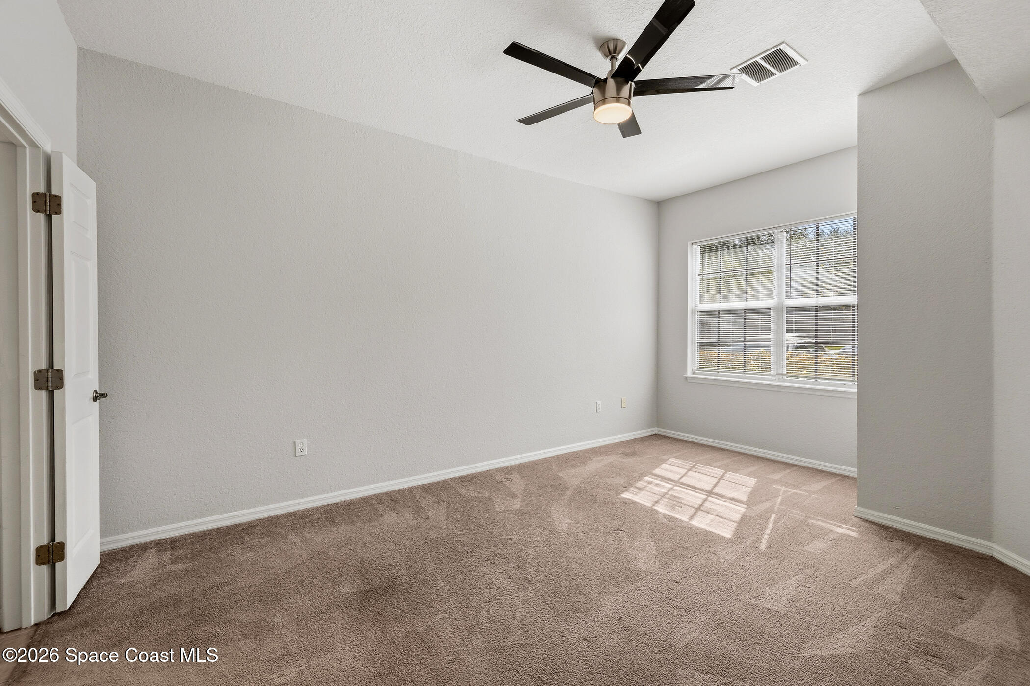 110 Colibri Way, Unit 103 Melbourne, FL 32901 - Photo 7 of 16 Downstairs Primary Bedroom