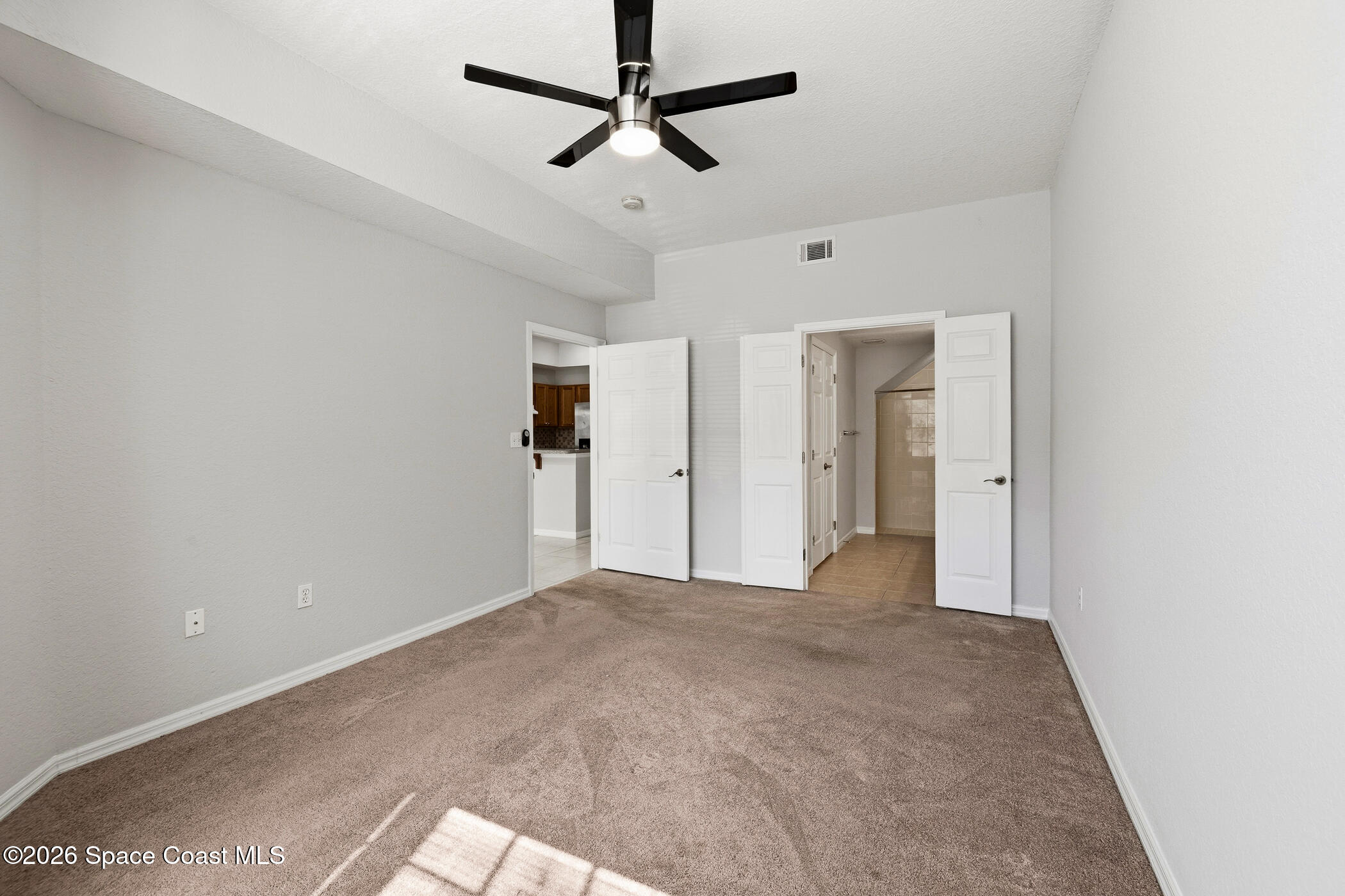 110 Colibri Way, Unit 103 Melbourne, FL 32901 - Photo 8 of 16 Downstairs Primary Bedroom