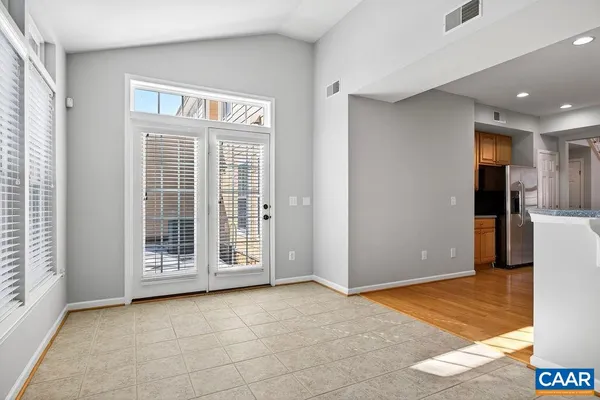 a view of an empty room with a ceiling fan