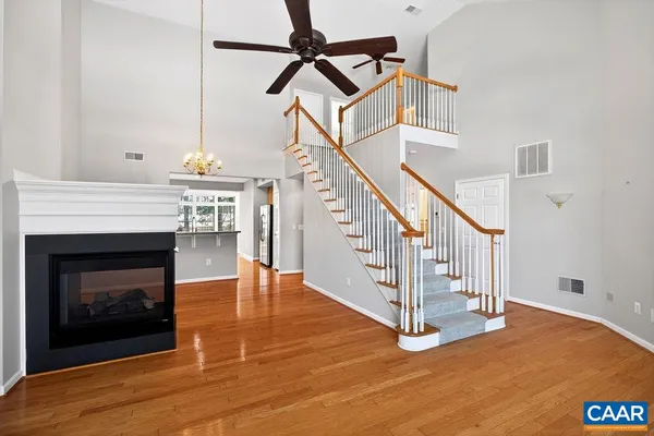 a view of entryway livingroom and hall with wooden floor