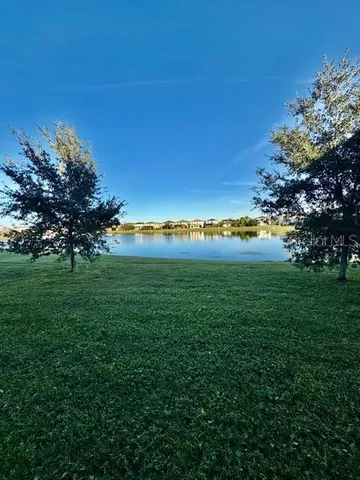 a view of an ocean and a building in the background