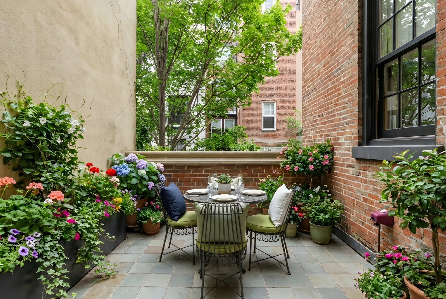 116 East 70th Street Manhattan, NY 10021 - Photo 12 of 22 a view of a chair and table in the backyard