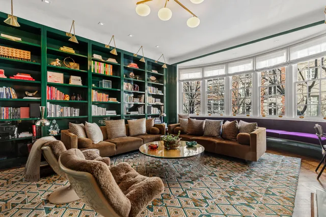 a table with a clock and a curtain