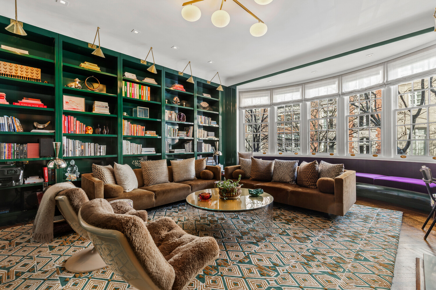 116 East 70th Street Manhattan, NY 10021 - Photo 14 of 22 a living room with furniture and a floor to ceiling window