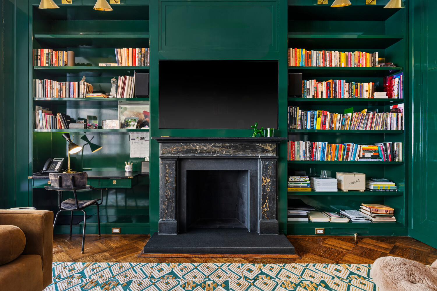 116 East 70th Street Manhattan, NY 10021 - Photo 15 of 22 a living room with fireplace furniture and a book shelf