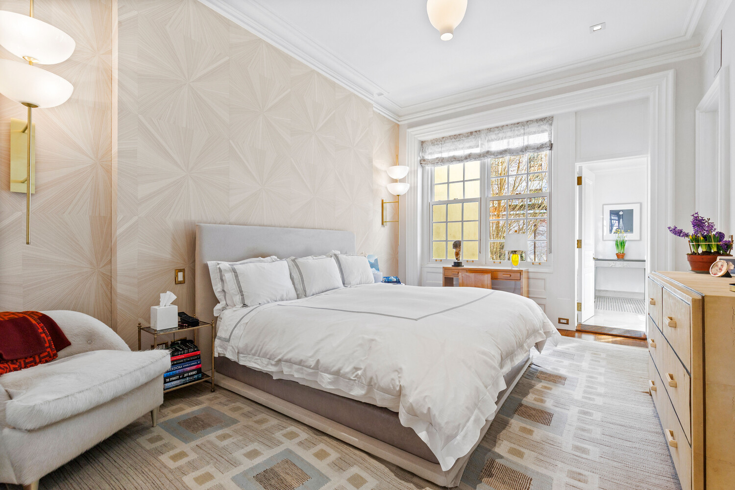 116 East 70th Street Manhattan, NY 10021 - Photo 16 of 22 a spacious bedroom with a bed couch and a window