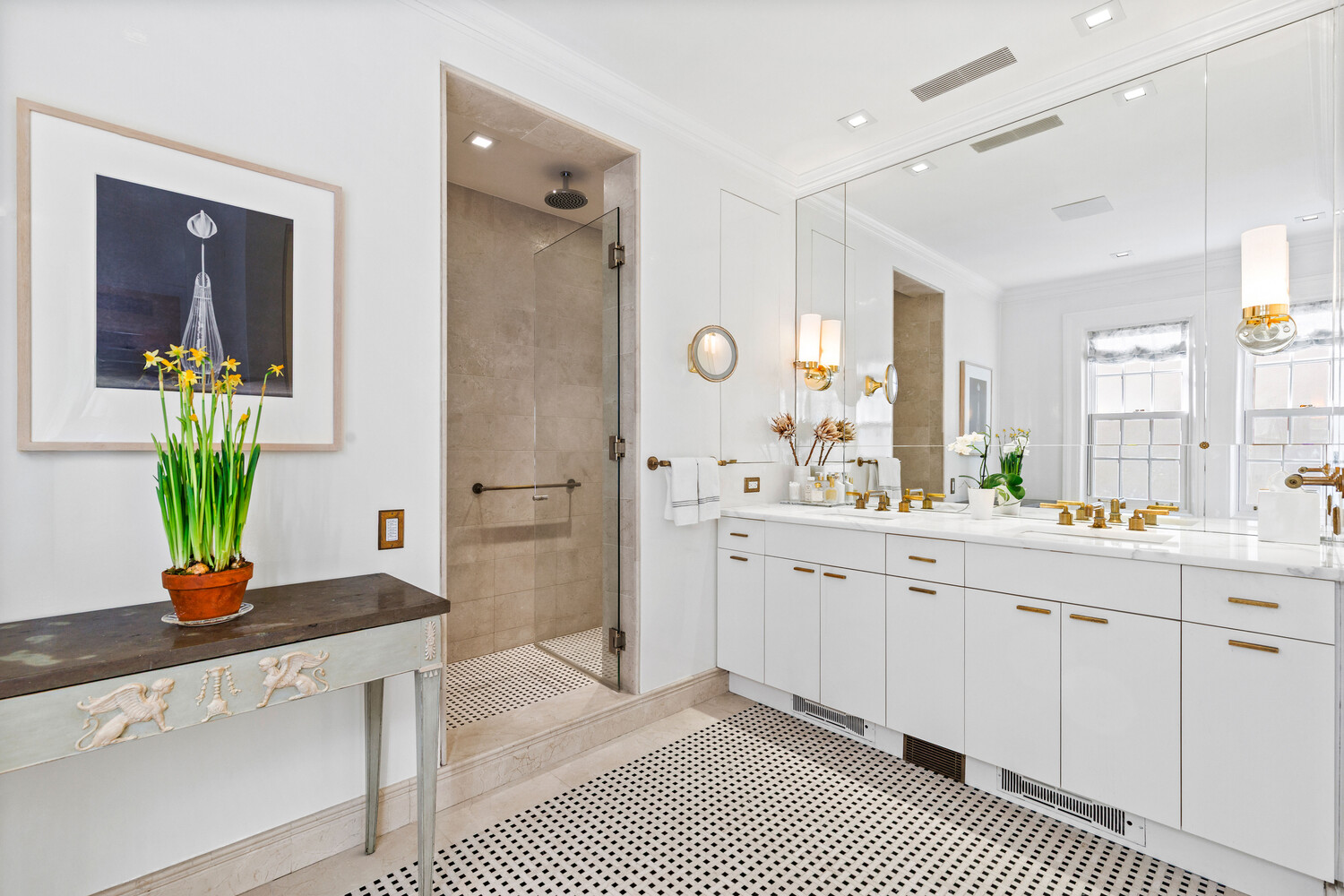 116 East 70th Street Manhattan, NY 10021 - Photo 17 of 22 a spacious bathroom with a shower a sink and a mirror