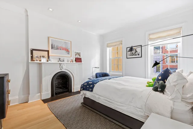 a spacious bathroom with a shower a sink and a mirror
