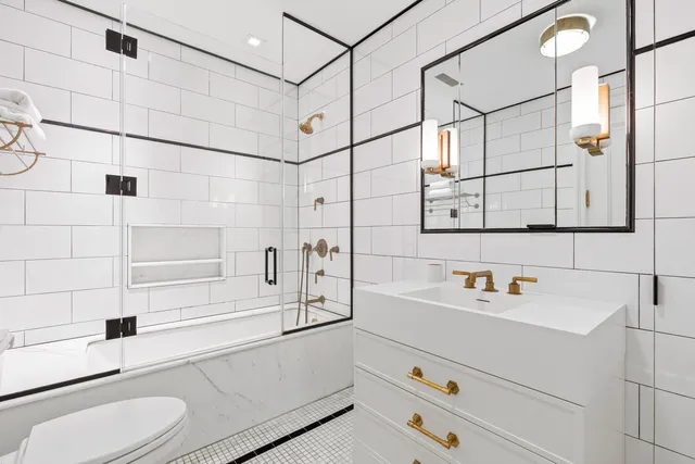 a bedroom with a bed and a couch