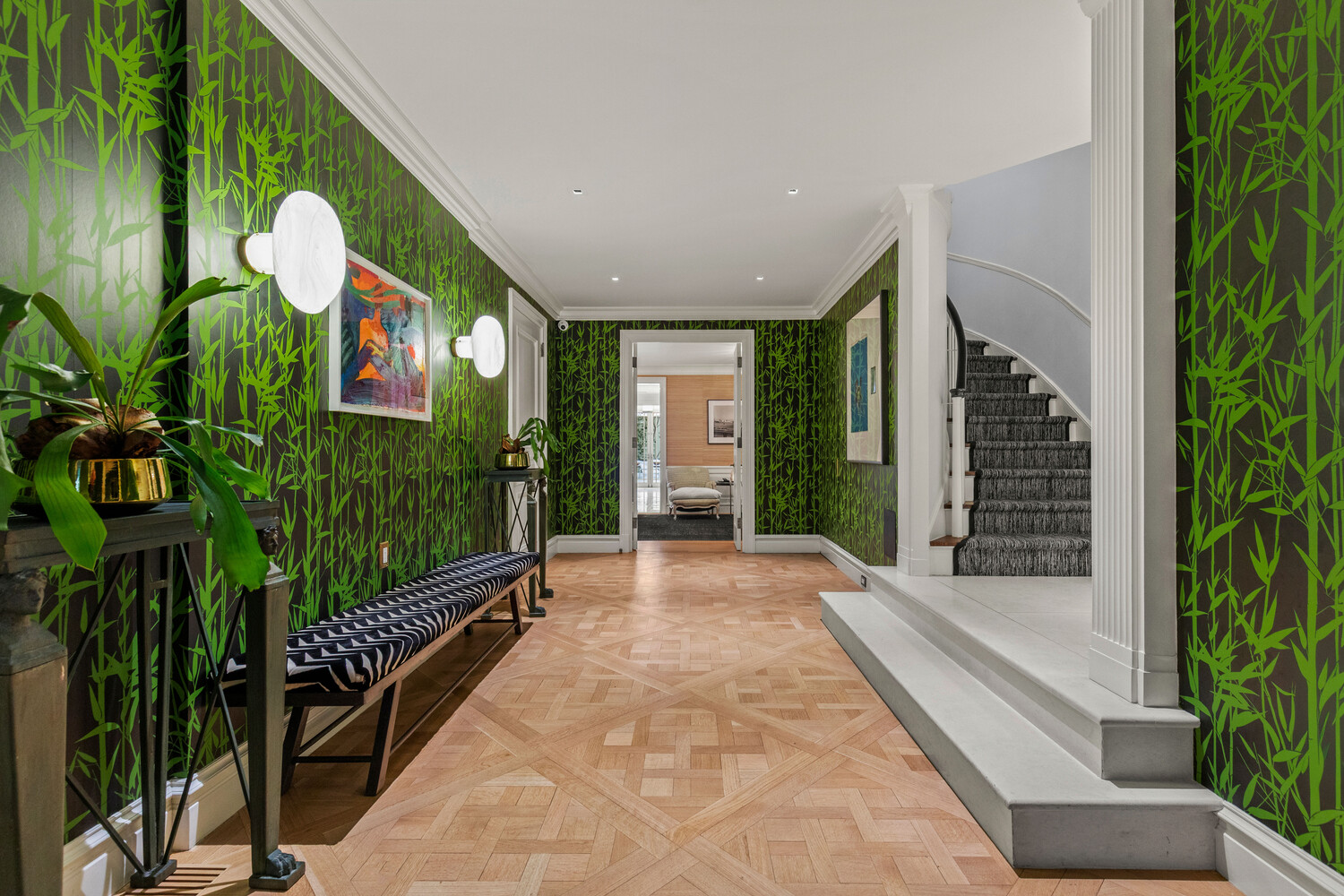116 East 70th Street Manhattan, NY 10021 - Photo 2 of 22 a view of a house with potted plants next to a road